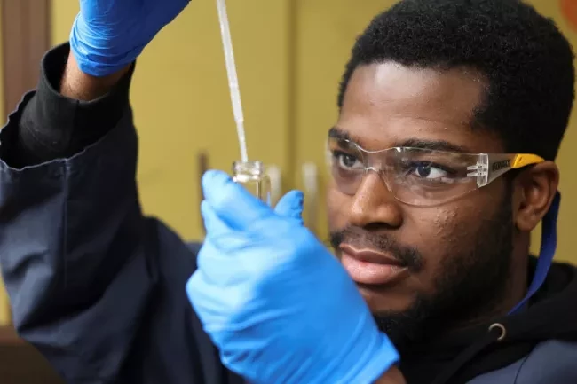guy with a pipette testing water